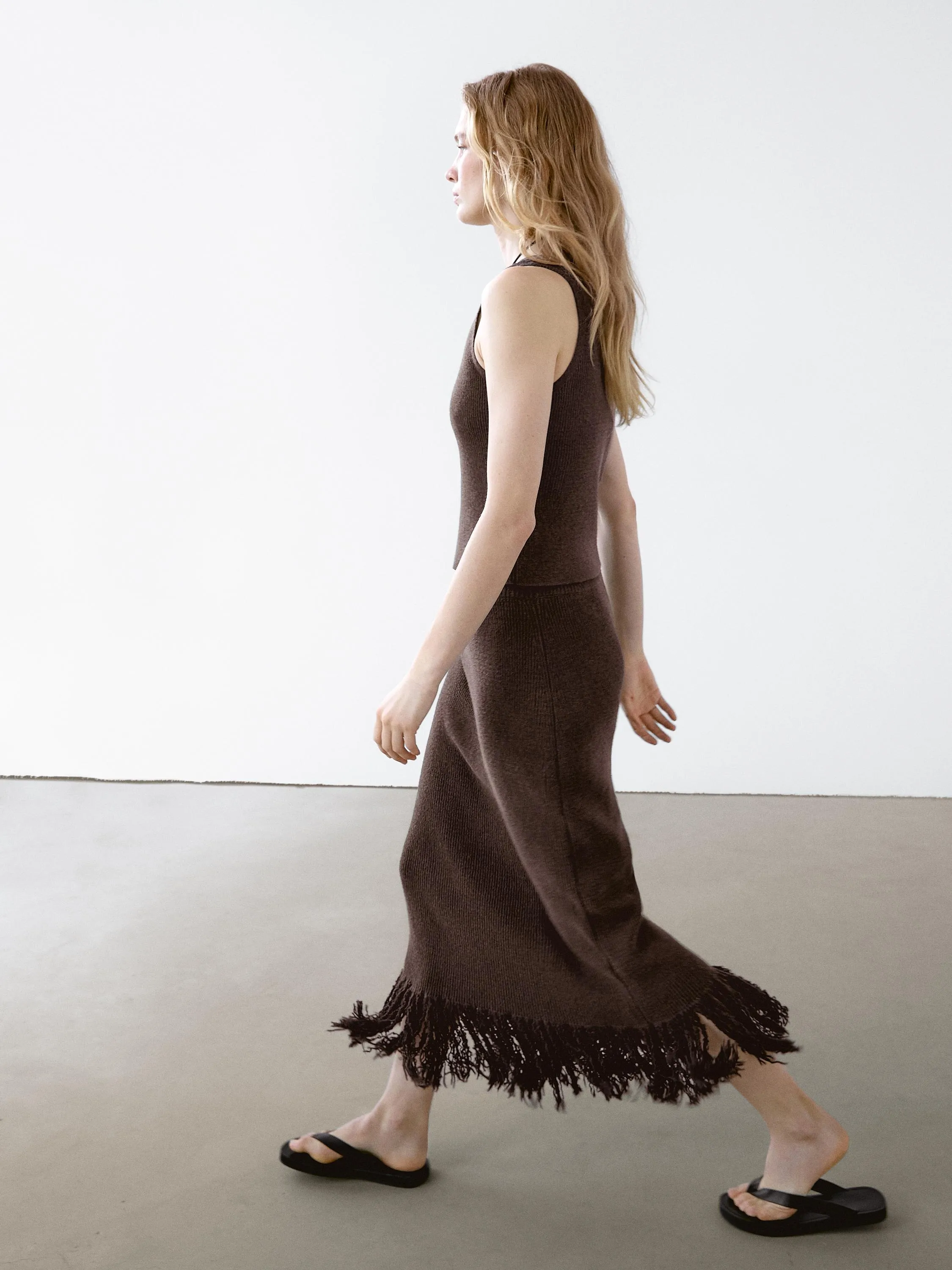 Long knit skirt with fringed hem