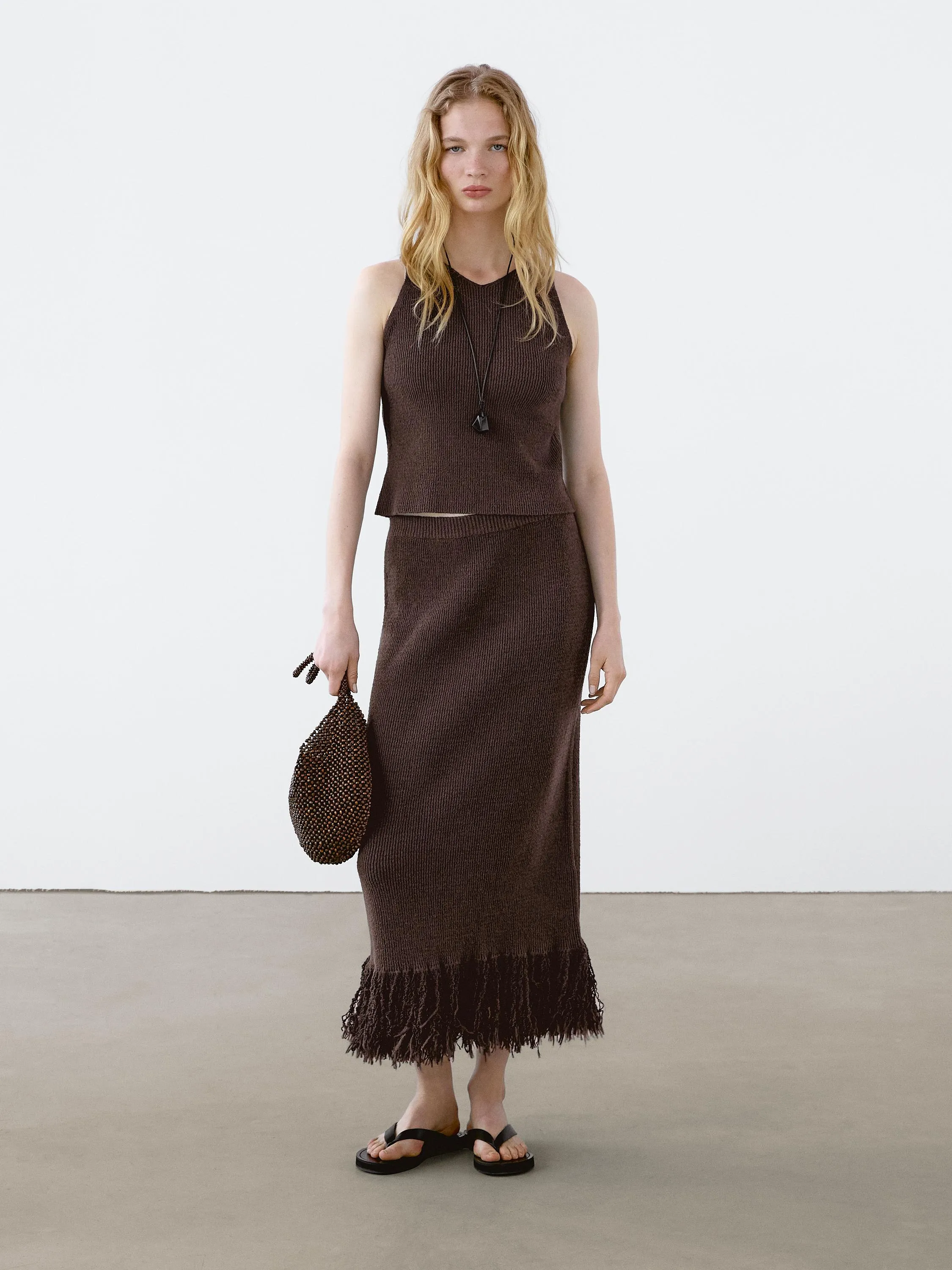 Long knit skirt with fringed hem