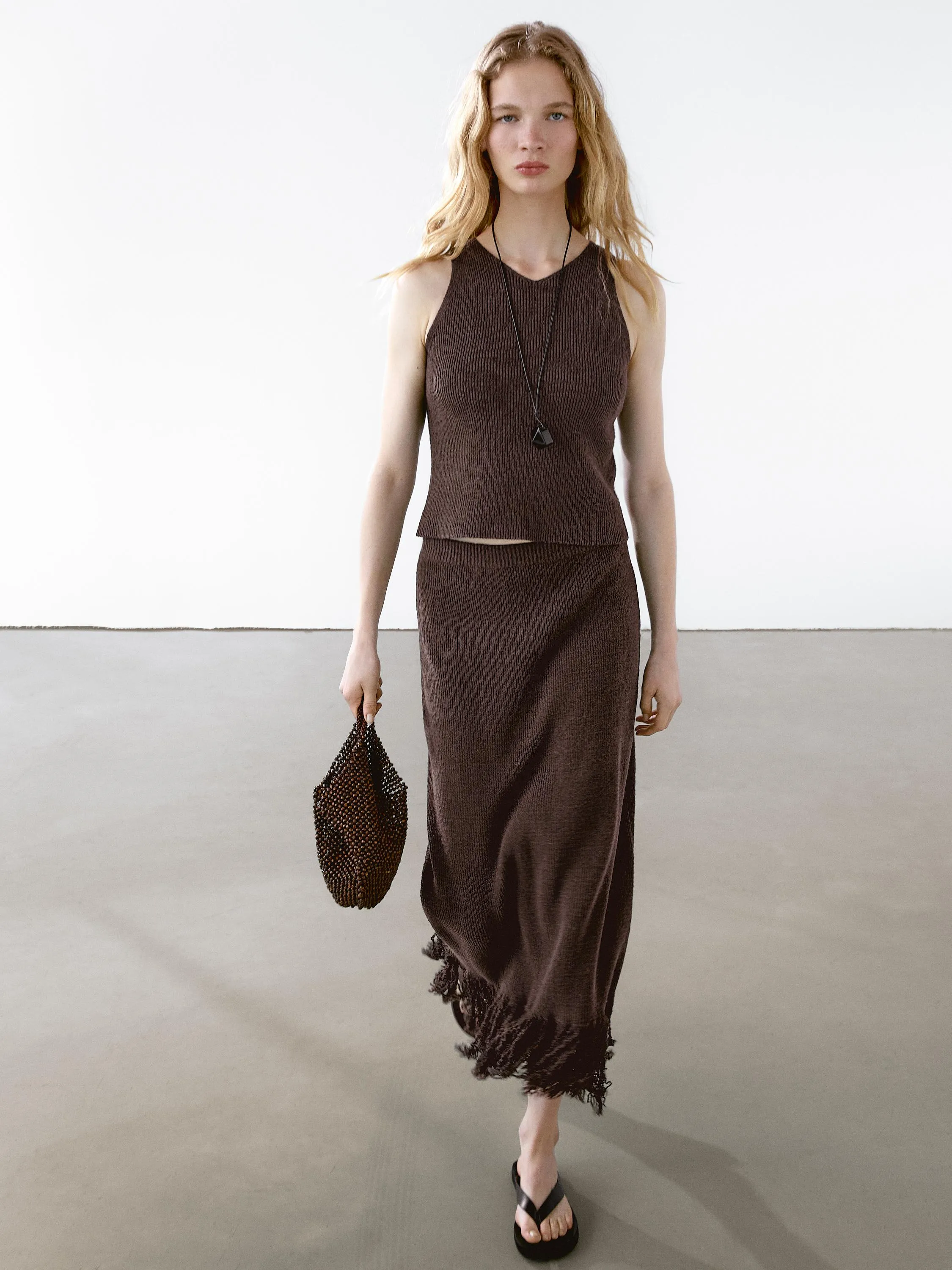 Long knit skirt with fringed hem